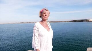 At 70, Eva takes a bite out of two young lads!