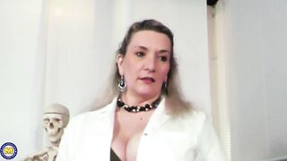 Busty, German aged with golden-haired hair is holding her legs spread wide open while getting fucked