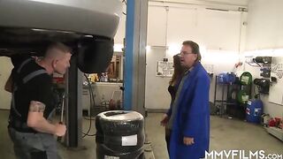 Tattooed brunette in black fishnets is having a 3some with mechanics to pay for the car repair