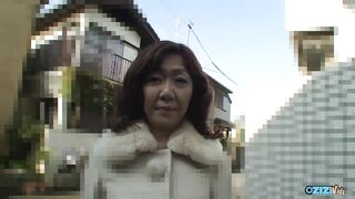 Asian brunette with ample bust raises her legs to let the cum ooze down her buns