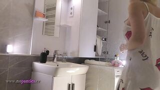 Hawt girl cute golden-haired lascivious angel in pink panties and with a satin nightie does the bath routine before intend to the daybed