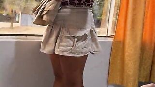 The hotel cleaning lady comes in to clean the windows and accepts a proposal for extra payment.