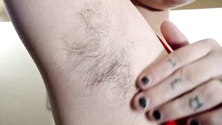 Long dark bushy armpits closeup