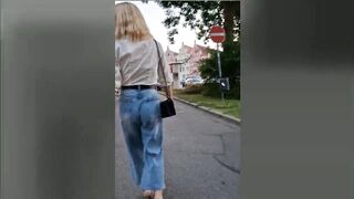Public wetting in the centre of the city! T-girl walking with soaked jeans!