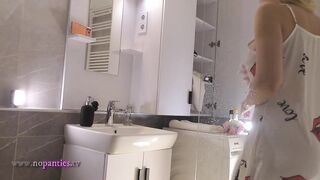 Sexy cutie cute golden-haired horny beauty in pink panties and with a satin nightie does the washroom routine before intend to the bed