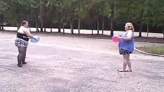BBW gals play volley ball with balloons