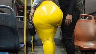 "Masked BBW Teases Giant Butt in Shiny Yellow Leggings on Public Bus"
