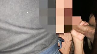 Nice-looking babe with big melons and tan lines is rubbing a stranger's penis through a gloryhole