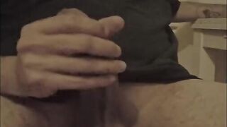 Latino jerks off his big penis until he cums