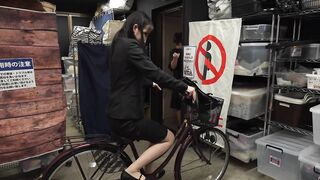Playing a prank on the bicycle saddle of a glamorous, big-buttocked office