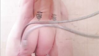 Redhead cleans her butt with a shower enema