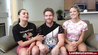 three friends are playing strip basketball indoors with high stakes