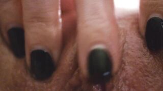 Woman masturbates snatch, clitoris closeup. Fingers slide on the clitoris.
