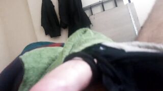 Puppy male playing with his tail