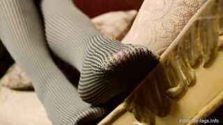 Mistress legs in opaque grey pantyhoses