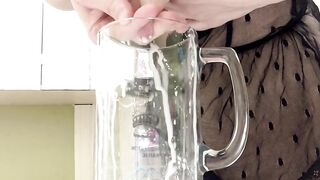 Sexy milf in lingerie squirting breastmilk into cup