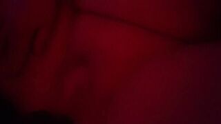 Playing with my exposed body beneath the red lights