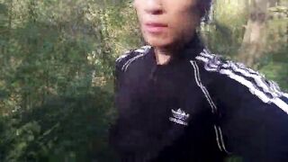 Who will spot this twink in a black-and-white Adidas tracksuit, flashing his weenie in public—going commando—and peeing into the river?