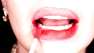 4K Applying red lipstick and smokin' hookah on black background
