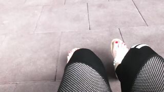 Sandals teasing outdoor with red toenails & toes wiggling
