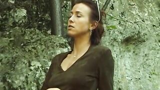 Delicious brunette masturbating outdoors