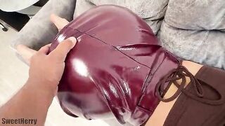 A brunette with a big butt put on a shiny leather skirt so that a guy would bang her in the ass after a date.