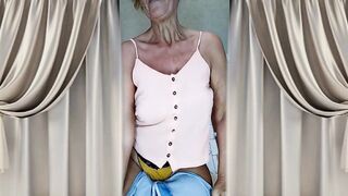 Cheerful old lady Lukerya. Captivating movements and shiny feet on the washing machine.