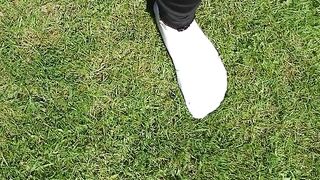 Wearing white socks, black leggings, and a long black shirt