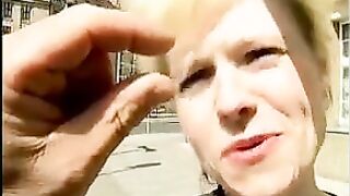 Golden-haired from the street shows her body