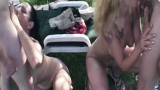 Tattooed Golden-haired MILF Slurps Thick Dick Outdoors with Brunette