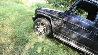 Golden-haired milf drives G-class in forest exposed walk
