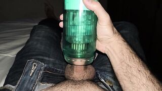 Suction toy on the bed sheets with jeans on and cumming outside