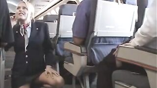Golden-haired stewardess, Riley Evans is rubbing a client's schlong on her 1st working day in the plane