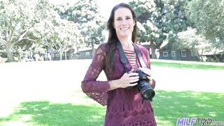 Long-legged brunette MILF photographer bangs young man in her photo studio