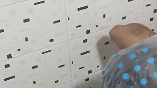 My sister-in-law goes to take a bath and I secretly spy on her; she has a big twat and admirable melons.