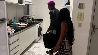 Hot brunette married woman giving head in the kitchen to the washing machine repairman.