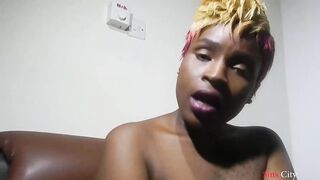 Bulky, Ebony sweetheart is rubbing her soaking wet snatch in front of the camera and enjoying it