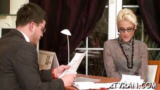 Fantastic blonde woman in shoes with high heels is into femdom sessions while at work