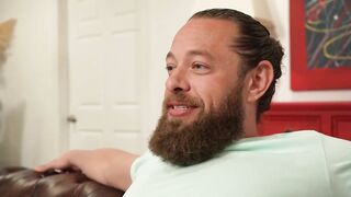 Teen brunette with big bazookas is having sex with a bearded chap, in the bedroom