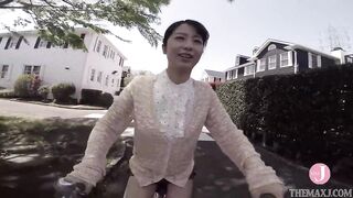 Ravishing, Asian brunette is showing her panties in a public place, in the middle of the day