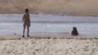 Sexually excited French brunette is fucking a handsome stranger on a nudist beach, during the day