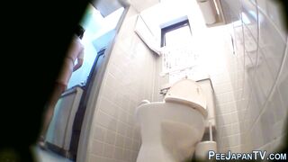 Asian in uniform peeing