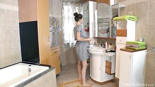 Busty brunette, Agneta always pays specific attention to her hairy vagina while having a shower