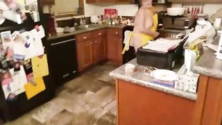 Obese granny with big, saggy breasts is spreading her legs wide open on the bed