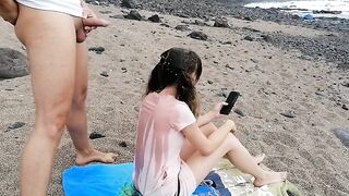 Pigtaile dteen brunette is about to get a golden shower on the beach, in the afternoon