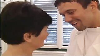 Short haired granny with big boobs is about to have sex with her doctor