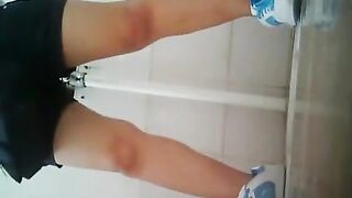 Asian women peeing in lavatory
