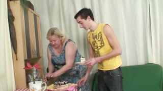 Slutty golden-haired granny is sucking a younger stud's dong before getting stuffed with it, from the back