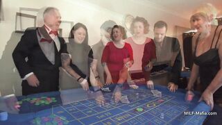 three British MILFs slip without evening dresses at the casino