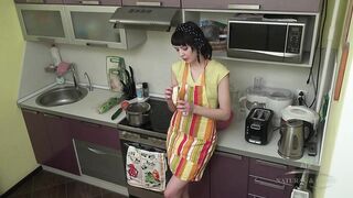 Petite short-haired housewife in high heels rubs her bushy vagina on the kitchen counter